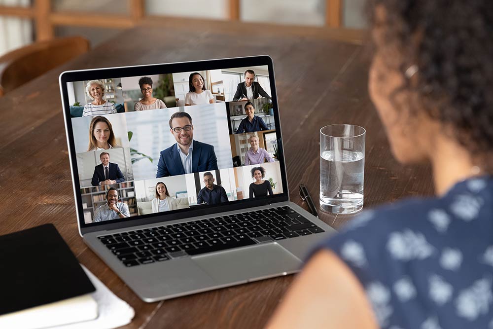 Person is looking into a screen with multiple participants