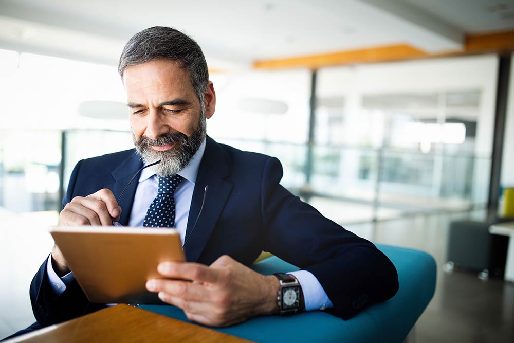 Senior manager looking at a iPad